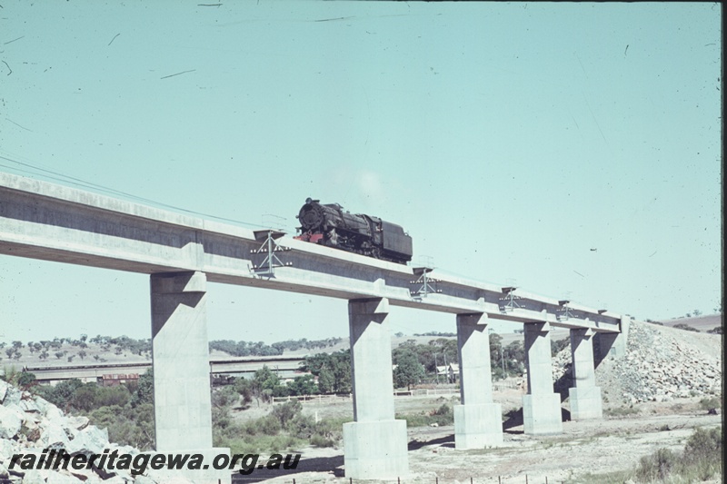 T04459
V class 1203 steam locomotive travelling light engine over the GSR bridge at Northam. The locomotive is heading to Avon Yard to work #24 Goods to Midland.
