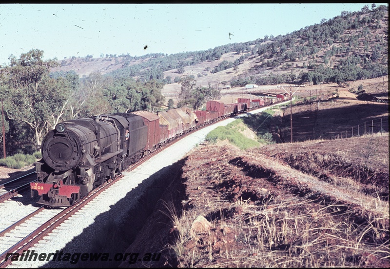 T04468
V class 1203 steam locomotive pictured at the head of a goods train in the Avon Valley.
