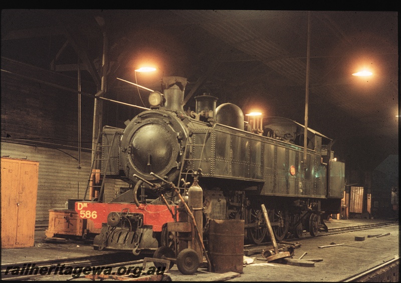 T04487
DM class 586 steam locomotive pictured in the East Perth Locomotive Depot at night.
