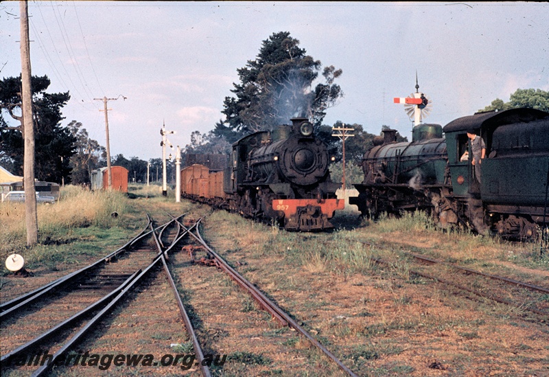 T04496
W class 957 crossing another W class  with their respective goods trains in the yard at Bridgetown, PP line. View also shows a yard light, water column, signals, telegraph pole and a double slip

