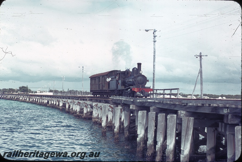 T04517
G class 123 steam locomotive with an unidentified ZA class brakevan on the Busselton Jetty.
