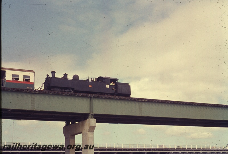 T04518
An unidentified DD class steam locomotive hauling a suburban set over the Fremantle Railway bridge enroute to Fremantle.
