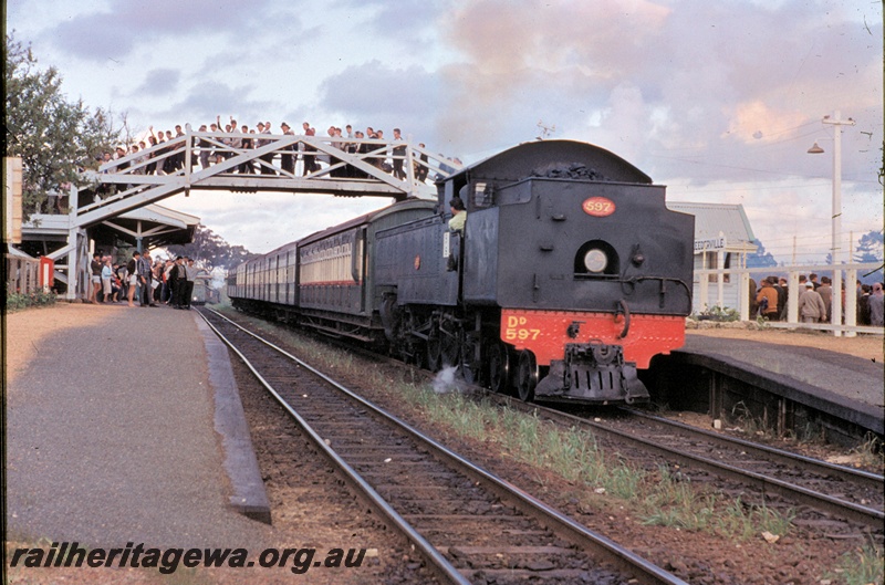 T04519
DD class 597 steam locomotive hauling a football special at West Leederville enroute to Perth. Note the passengers on the footbridge
