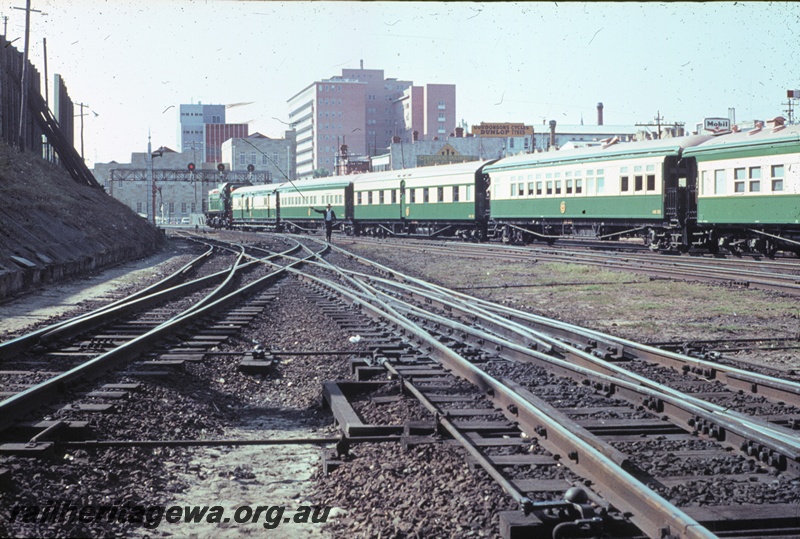 T04555
A class 1511 diesel locomotive with the Royal train passing through Perth Station prior to setting back to the Armadale dock. The consist of the train is clearly seen in this view with the Vice Regal car at the rear.
