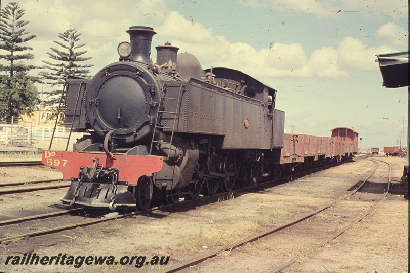 T04567
DD class 597 steam locomotive with a load of empty wagons at Bassendean. See T4565.

