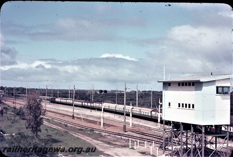 T04607
R Class 1902 diesel locomotive hauling a special passenger train arriving in Kwinana yard from Coogee. The former Koojedda signal box is pictured to the right. Same train as T04596
