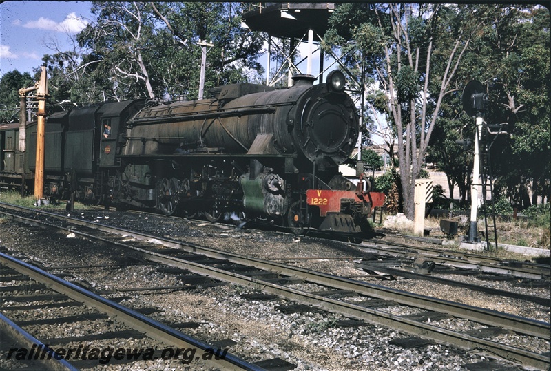 T04625
V  class 1222 steam locomotive and an unidentified Z class brakevan, searchlight signal, telephone box, water column with the extended column, Koojedda, ER line, side and front view.
