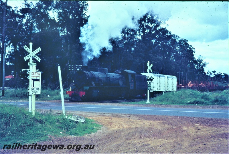 T04719
An unidentified W class steam locomotive hauling a goods train in the lower South West. Note 2 EB class iced vans behind the locomotive. 
