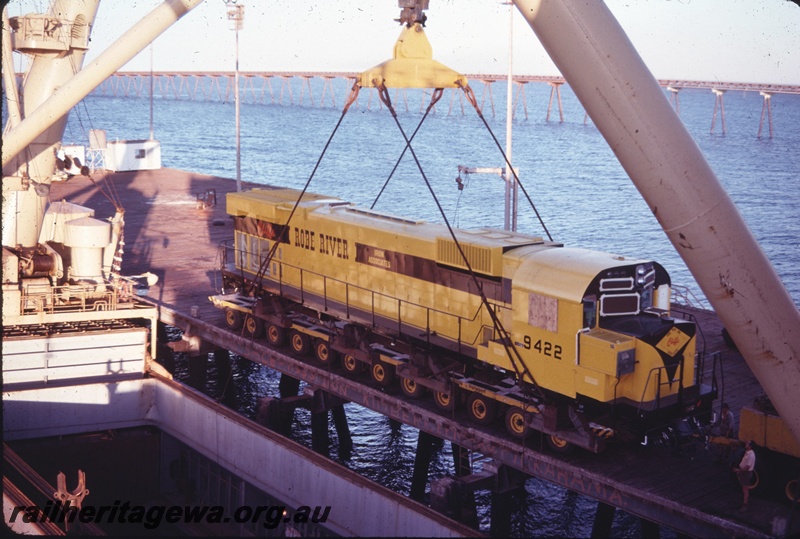 T04749
Cliffs Robe River (CRRIA) new M636 class 9422 being off loaded from ship at Cape Lambert .
