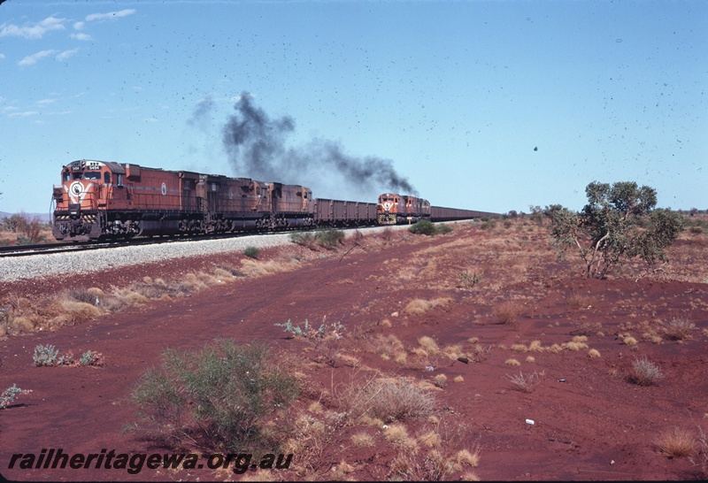 T04756
Mount Newman Mining M636 class 5492 and M636 class 5468 haul loaded ore train being overtaken by M636 class 5473 between Newman and Port Hedland. 
