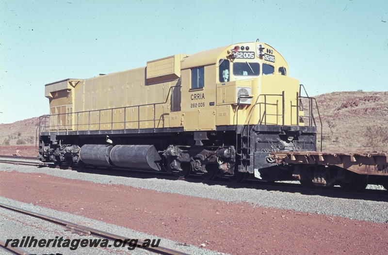 T04764
Cliffs Robe River M636 class 262.005 (later renumbered 1714) in original all yellow livery shunts a construction train at Cape Lambert. 
