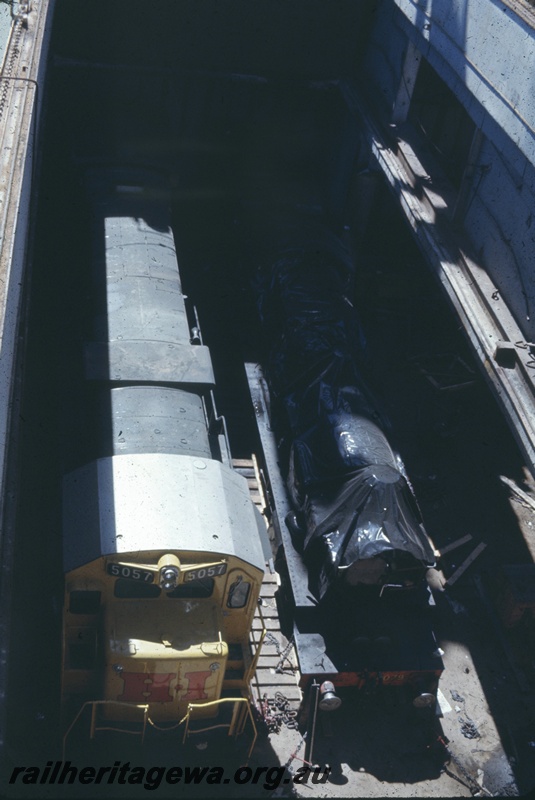 T04766
Hamersley Iron (HI) GE36-7 class 5057 (Goninan-GE) in the hold of vessel MV Iron Baron prior to being lifted onto wharf at Dampier.
