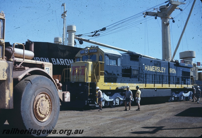 T04779
Hamersley Iron (HI) GE36-7 class 5059 (Goninan-GE) on wharf at Dampier after being unloaded from vessel MV Iron Baron. 
