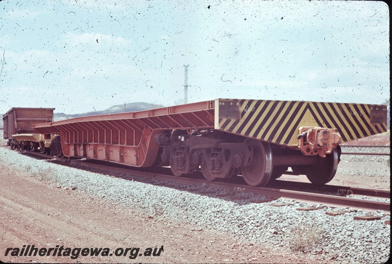 T04797
Hamersley iron (HI) DW class deep well wagon - 6 wheel bogie built by Nippon Sharyo.
