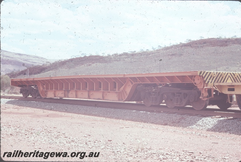 T04801
Hamersley iron (HI) DW class deep well wagon - 6 wheel bogie built by Nippon Sharyo.
