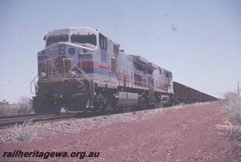 T04809
Hamersley Iron (HI) GE Dash 9-44CW class 7093 on the lead of a loaded ore train 
