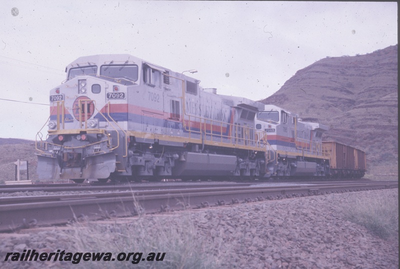 T04810
Hamersley Iron (HI) GE Dash 9-44CW class 7092 and 7065 on the lead of a loaded ore train at Tom Price.
