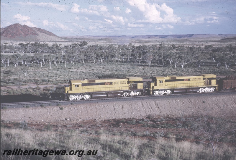 T04844
Cliffs Robe River (CRRIA) M636 class 1712 &1710 haul loaded iron ore train near Cooya Pooya.
