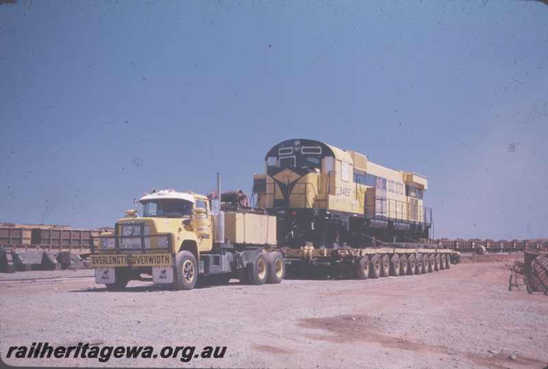 T04847
Cliffs Robe River (CRRIA) M636 class 9422 being transported by road from Cape Lambert Wharf to Cape Lambert railway workshops for commissioning. 
