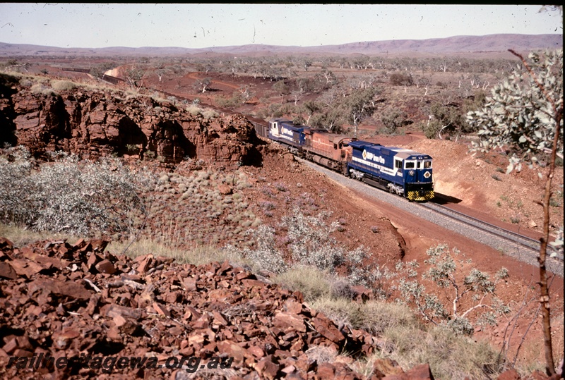 T04852
BHP Iron Ore CM36-7M class, M636 class & CM36-7M class approach Kalgan with a loaded ore train 
