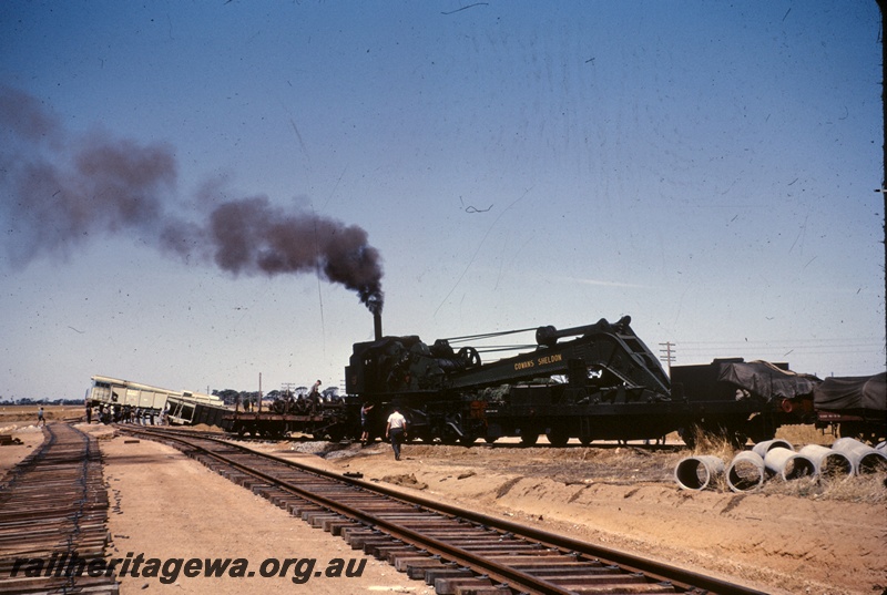 T04900
Derailment, Cowans Sheldon 60 ton crane, flat bed wagon, covered wagon, diesel loco and wagons off track, workers, Doodlakine, EGR line,
