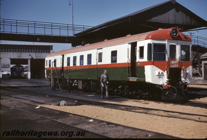 T04933
ADG class 607, another ADG class railcar in shed, fuelling point, point lever, worker, pedestrian overpass, East Perth depot, ER line
