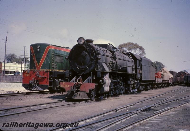 T04938
A class 1508, V class 1203 on goods train, points, front and side view
