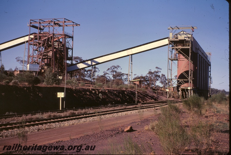 T04942
Ore loading bins, conveyors, stop sign, Koolyanobbing, EGR line, view from track level
