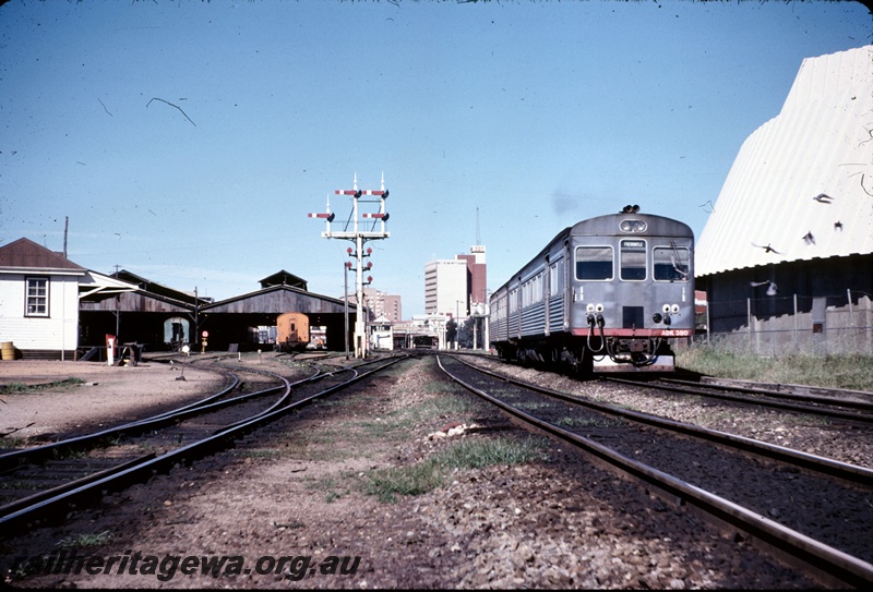 T04966
Two car DMU, led by ADK class 390, carriage sheds, bracket signals, signal box, leaving Perth station for Fremantle, second last day before closure of Fremantle line
