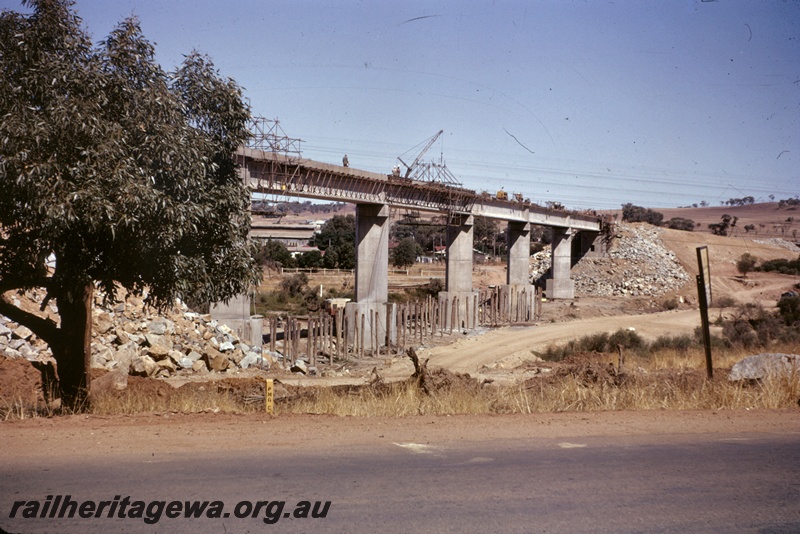 T04981
Bridge, concrete and steel, under construction, over Avon River, workers, crane, houses, road, GSR line, view from river bed
