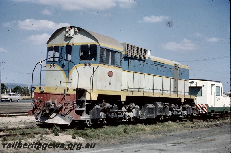 T05131
J class 101, in dark blue and light blue with yellow stripe coupled to a Matsia Track Recorder Car, rear and side view
