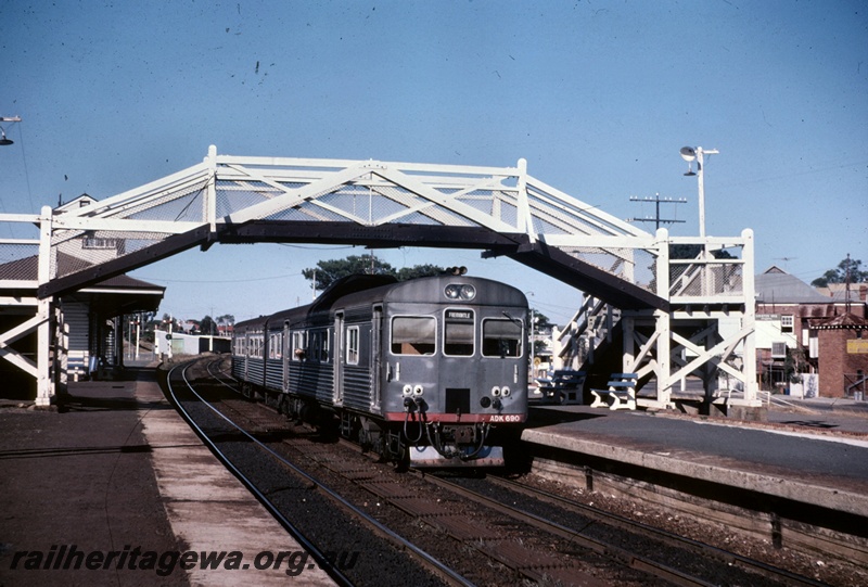 T05139
ADK class 690 heading two car DMU set bound for Fremantle, platforms, station building, signals, pedestrian footbridge, Subiaco, ER line
