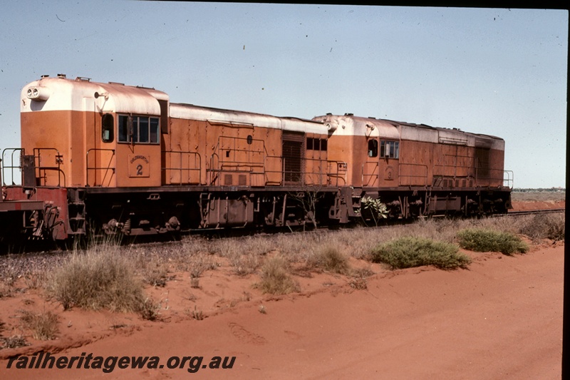 T05177
Goldsworthy Mining (GML) B class 2 and unidentified A class locomotive near Finucane Island.
