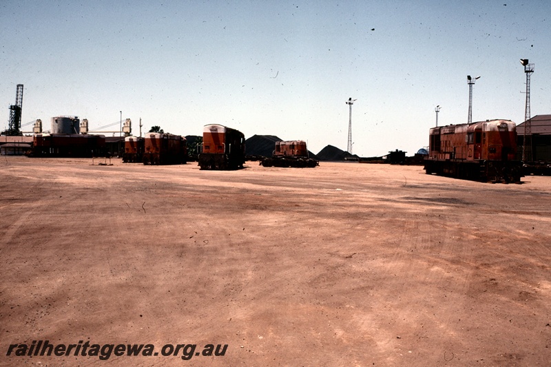 T05180
Goldsworthy Mining (GML) A class locomotives in yard at Wedgefield, Port Hedland waiting for shipment to NSW.
