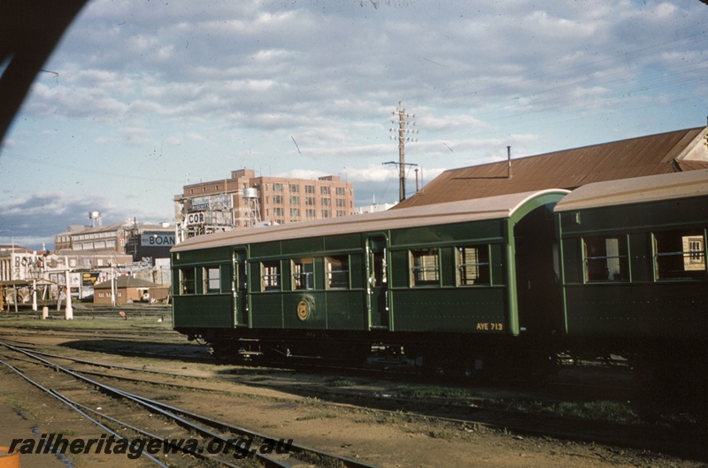 T05223
AYE class 713, coupled to another AYE class carriage (part view only) both in the plain green livery, signals, end of platforms, canopy, Boans store, Post Office building, sidings, Perth station yard, side and end view
