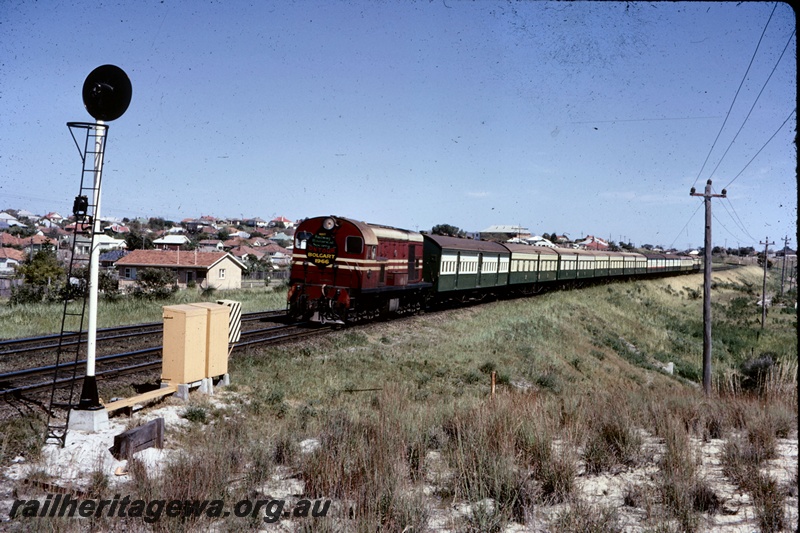 T05247
Ex MRWA F class diesel in red livery with white stripes on ARHS tour train to Bolgart, light signal, houses, Bayswater, ER line
