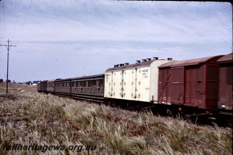 T05248
Mixed consist of train number 191, comprising vans and passenger cars including ACL class 389, ACL class 403 and AL class 88, Kalgoorlie, EGR line, side view along part of train
