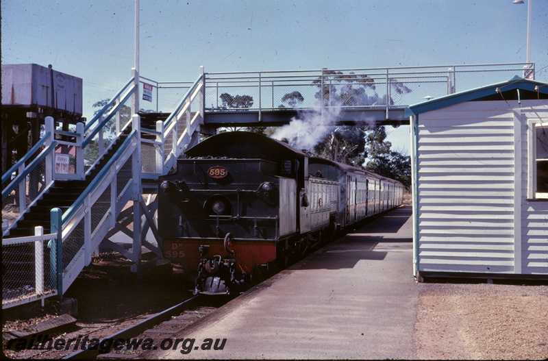 T05257
DD class 595 bunker first, on passenger train, water tower, pedestrian footbridge, platform, station building, Armadale, SWR line
