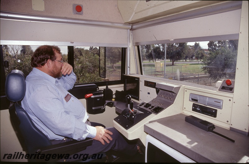 T05281
Internal view of an S class diesel loco cab with the driver at the controls
