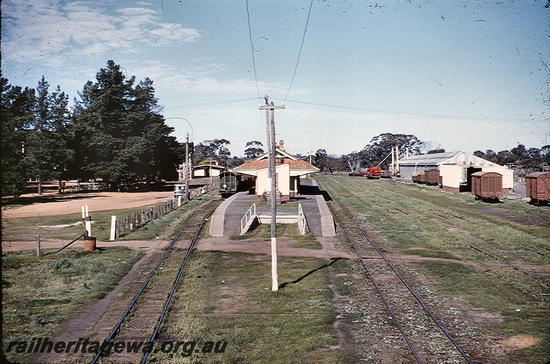 T05302
Station building, platform showing the cart dock, wheat silo, 3rd Class goods shed, Tambellup, GSR line elevated view taken from the 