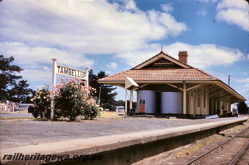 T05303
Station building, nameboard, lever frame, Tambellup. GSR line, north end of building looking south along the line. C.1961,  Compare with P19108 taken in 2001
