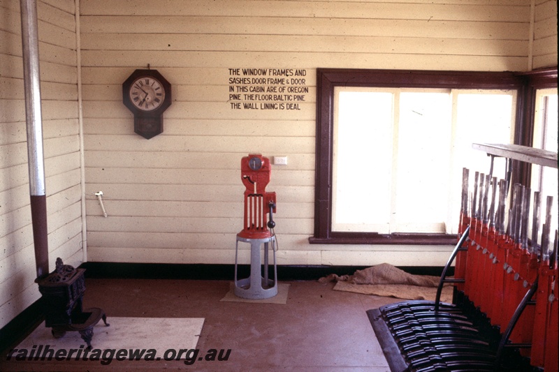 T05312
Signal box restoration, interior view, stove, clock, electric staff instrument, lever frame, sign detailing timbers used in construction, Merredin, EGR line 
