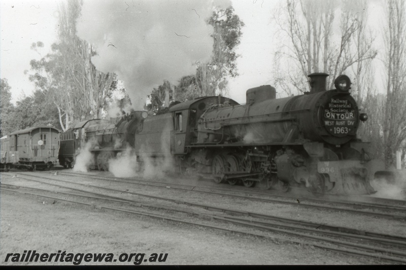 T05381
W class locos double heading Australian Railway Historical Society tour train, van, rural setting, side and front view
