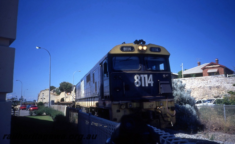 T05383
Pacific National 81 Class 14, on train of flat wagons, near the Roundhouse, heading for Fremantle, ER line, side and front view
