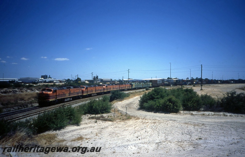 T05385
Genesee & Wyoming CLP class locos 13, 11, 16 and 8 in orange and black livery, ALF class  locos 19 and 25 in green and gold livery, sextuple heading intermodal freight train, front and side view
