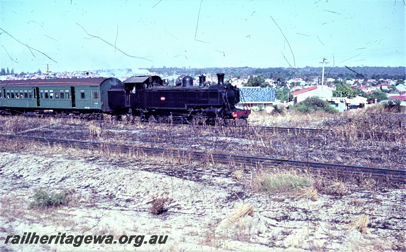 T05618
Dd class  hauling a passenger train. All green AYB class carriage behind locomotive.
