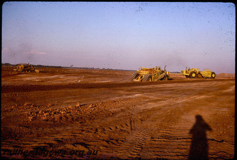 T06003
Standard gauge project construction, scrapers, bulldozer, unknown location
