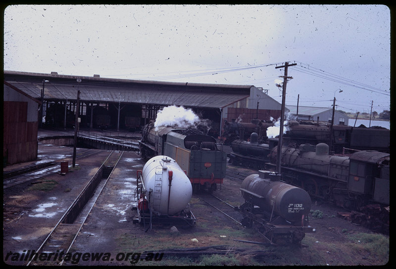T06132
V Class 1220, PMR Class 729, G Class 233 and other steam locos, Bunbury roundhouse, JOA Class 11312 distillate tank wagon, fuel tank, turntable, ash pit
