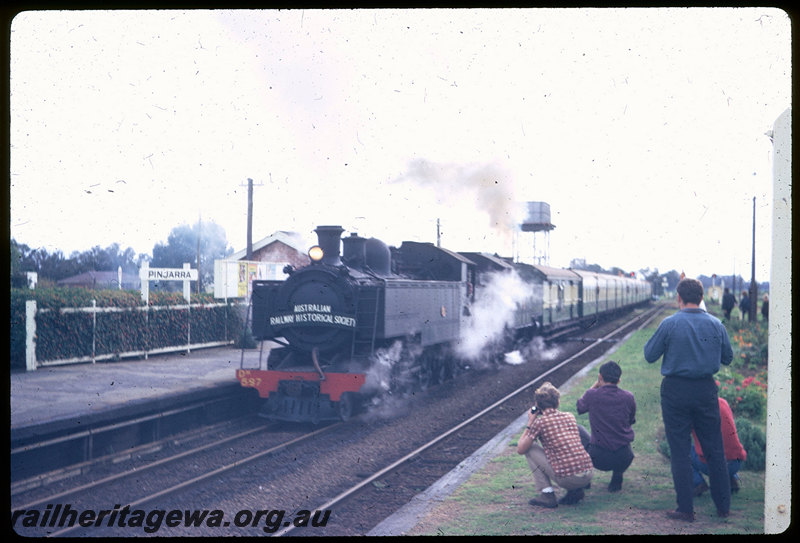 T06180
DM Class 587 and DD Class 592, ARHS tour train to Coolup, Pinjarra Station, station sign, platform, water tower, photographers, SWR line
