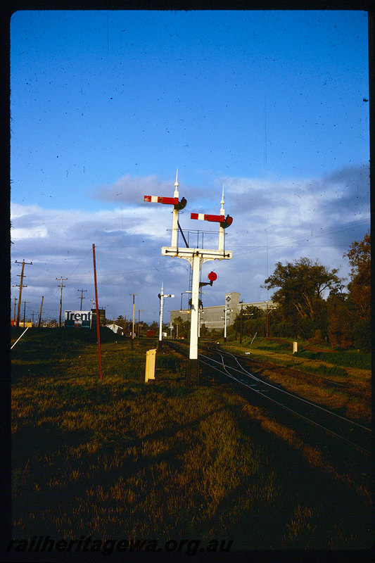 T06220
Picton Junction, semaphore bracket signal, shunt dolly, relay box, billboard, CSBP superphosphate works, SWR line
